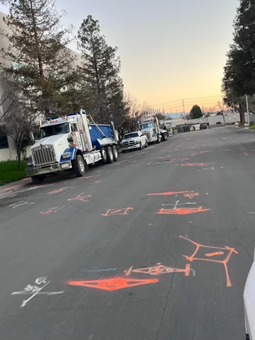 Street markout with trucks staged along the kerb
